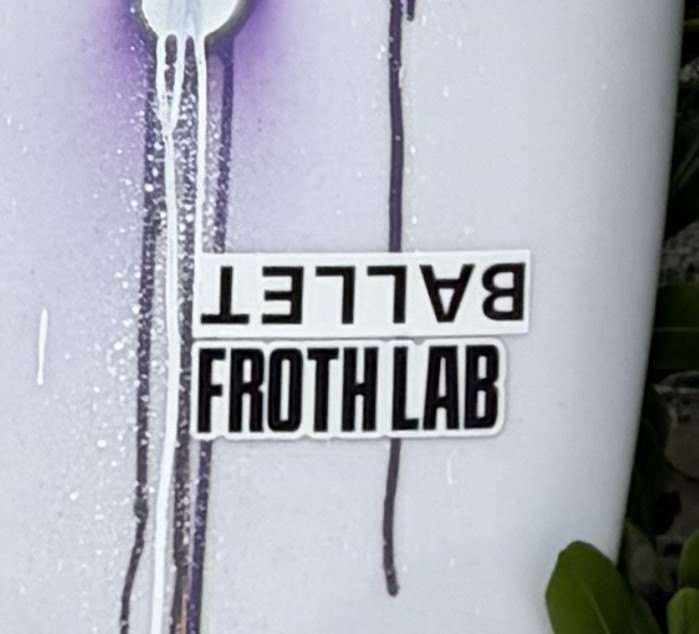 Froth Lab stickers on the decks of my boards